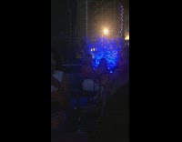 Two girls selfie blue lighting dark bar