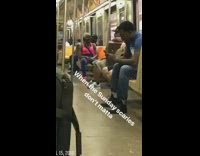 Woman dances by herself with earphones on subway train