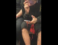 Guy bites nails on subway train tattoos 