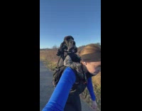 Dog skates with woman 