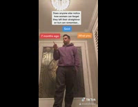 Purple sweater guy points to captions 