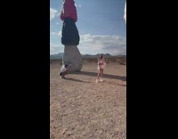 Girl White top hold sunglasses colorful rocks part 1