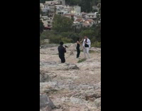 Couple dance video on mountain parthenon greece