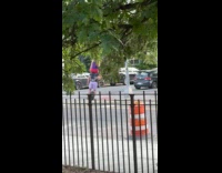 Guy rides unicycle carries girlfriend on shoulder
