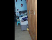 Dog on bed mad ignores woman talking