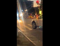 Multiple motorcycles on street at night