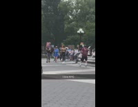 People march protest around water fountain park 