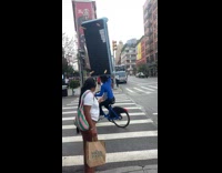 Man ride bike carry sofa over his head