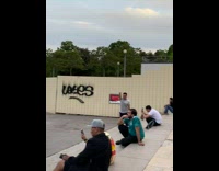 Man reaches hands to touch the top of the tower