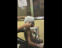 Guy pulls of plastic head piece used to dye hair off of kids head