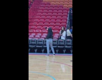 Girl takes selfie at basketball game 