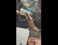 Lady yellow phone super long pink nails subway