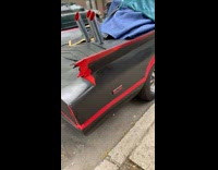 Collab WINY - Covered customized batman theme car parked on street