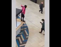Pink black jacket guy raps closed kiosk 