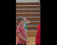 Kid gets hit with ball on face