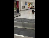 Woman black jacket sing and laugh airport