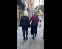 Collab WINY - Woman walks with green parrot on shoulder Part 2