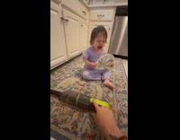 Toddler turns on vacuum cries to the sound of it 