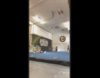 Black shorts girl falls on landing mat