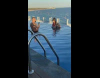 Woman in red bikini touches boobs for tiktok