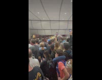 Huge Crowd Stands in Line on an Airport