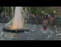 Group of people fight in inflatable pool at park with floaties part 3