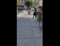 Guy walk on street throw newspaper strips