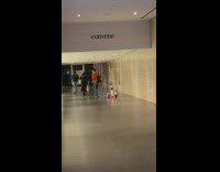 Guy walks as his Ninebot Segway follows 