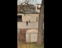 Woman ballet leap empty yard video shoot