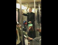 Guy in black dress shirt standing subway gold string being sucked into air conditioning vent