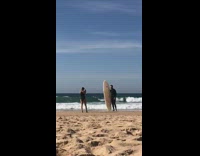 Collab Kook Of The Day - Black wetsuit guy poses white surfboard beach