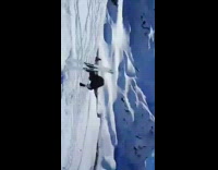 Skier does a back flips, hits the front of his ski on the snow and falls