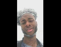 Guy outside snowstorm face and beard covered in snow