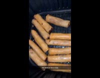 Pulling out egg rolls from air fryer then zoom to cat 