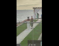 Woman in white dress tiktok dance at the beach aisle