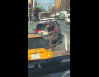 Guy covered face dance wildly in city