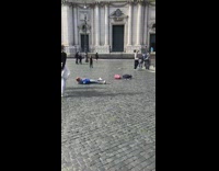 Girl lays back photographs two guys fountain 