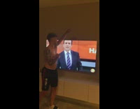 Guy lifts arm up sniff armpit television 