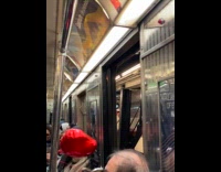 Heart balloon almost stuck on subway doors