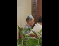 Guy wears mask on head at restaurant