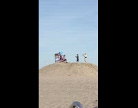 Guy shark costume red chair sand hill