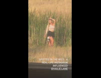 Woman one shoulder top tall grass tripod