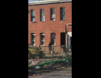 Abandoned brick building photoshoot construction site debris 