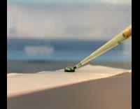 Adding dye water droplet on wax paper

