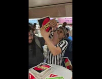 Bunch of people play big Uno on train 