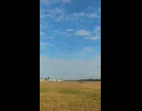 Guy coming down in parachute falls on face