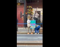 Person rat costume with sign at Marathon