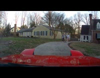 Red car pop up headlight blinks at girls