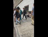 Girl brown khaki coat sit train station entrance