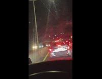 Man on highway gets out to pee in traffic